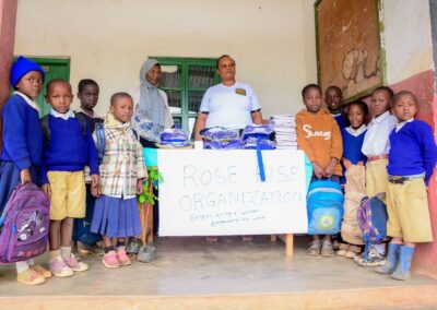 Rose Rise Personnel Offering Scholastic Materials and Tree Seedlings for an Afforestation Project in Schools 1