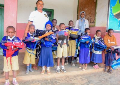 Rose Rise Personnel Offering Scholastic Materials and Tree Seedlings for an Afforestation Project in Schools 11