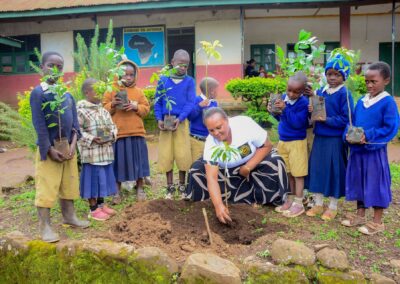 Rose Rise Personnel Offering Scholastic Materials and Tree Seedlings for an Afforestation Project in Schools 12