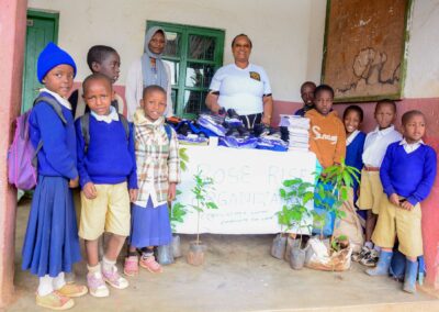 Rose Rise Personnel Offering Scholastic Materials and Tree Seedlings for an Afforestation Project in Schools 2