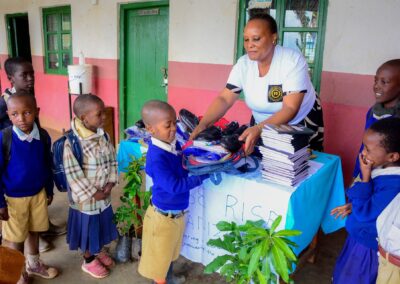 Rose Rise Personnel Offering Scholastic Materials and Tree Seedlings for an Afforestation Project in Schools 3