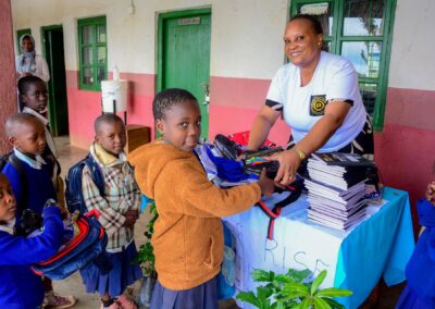 Rose Rise Personnel Offering Scholastic Materials and Tree Seedlings for an Afforestation Project in Schools 4