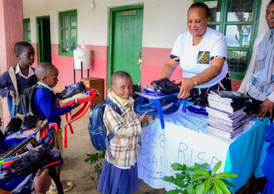 Rose Rise Personnel Offering Scholastic Materials and Tree Seedlings for an Afforestation Project in Schools 6