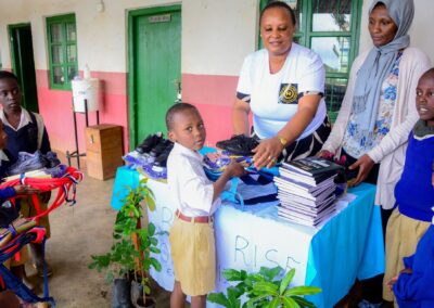 Rose Rise Personnel Offering Scholastic Materials and Tree Seedlings for an Afforestation Project in Schools 7