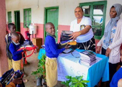 Rose Rise Personnel Offering Scholastic Materials and Tree Seedlings for an Afforestation Project in Schools 8