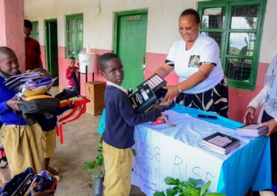 Rose Rise Personnel Offering Scholastic Materials and Tree Seedlings for an Afforestation Project in Schools 9